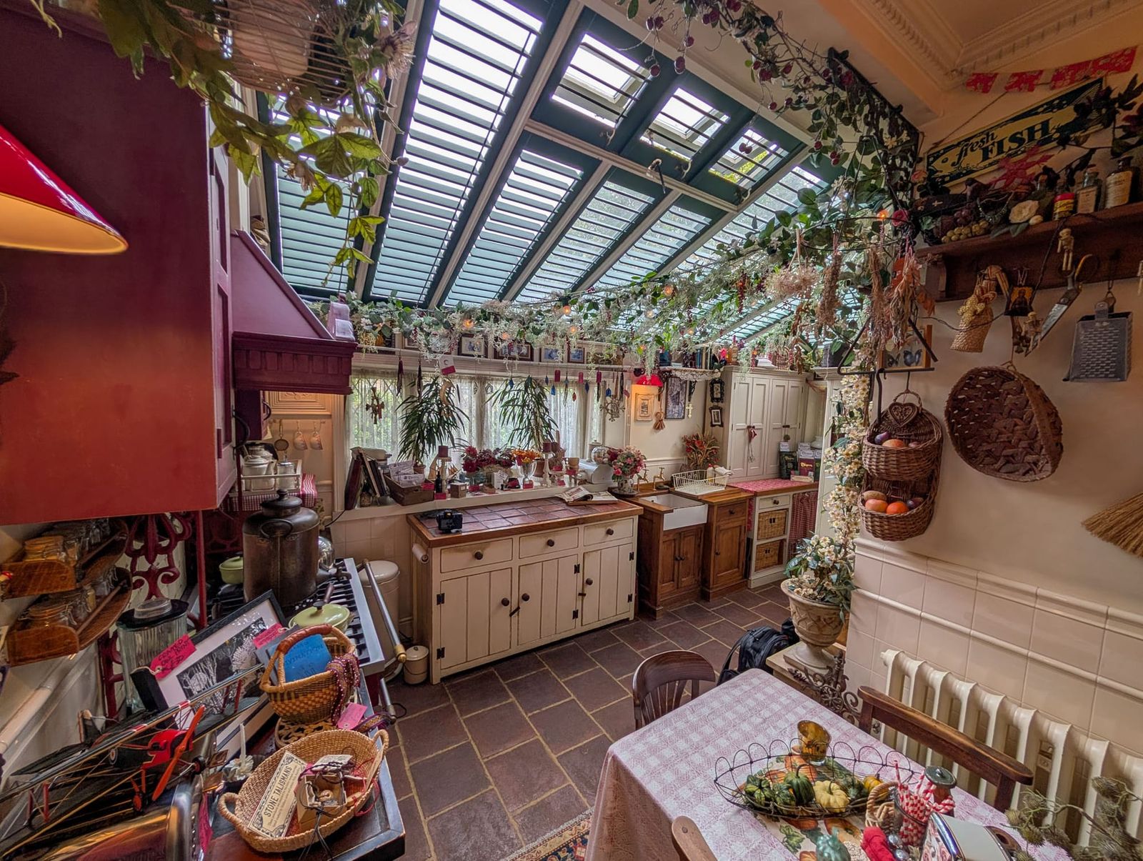 The plant-filled conservatory kitchen at Talliston House and Gardens.