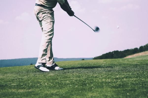 A man playing golf