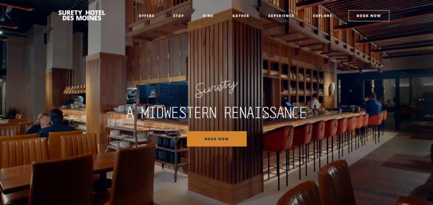 A screenshot of surety hotel's homepage, showcasing its sleek interior design
