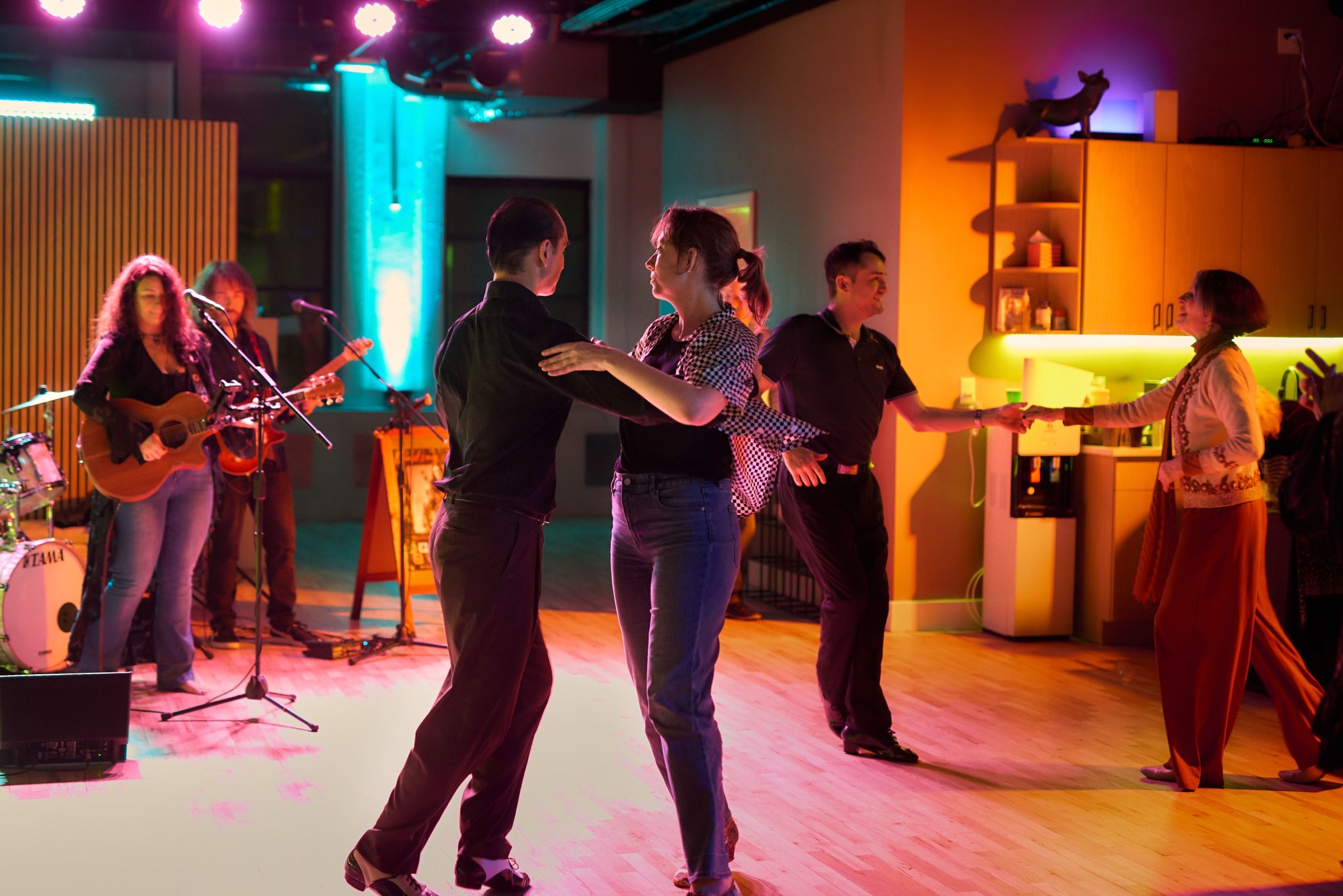 Couples dancing at a Salon Series night while Lindsay Jordan and her band play live at Big Apple Ballroom