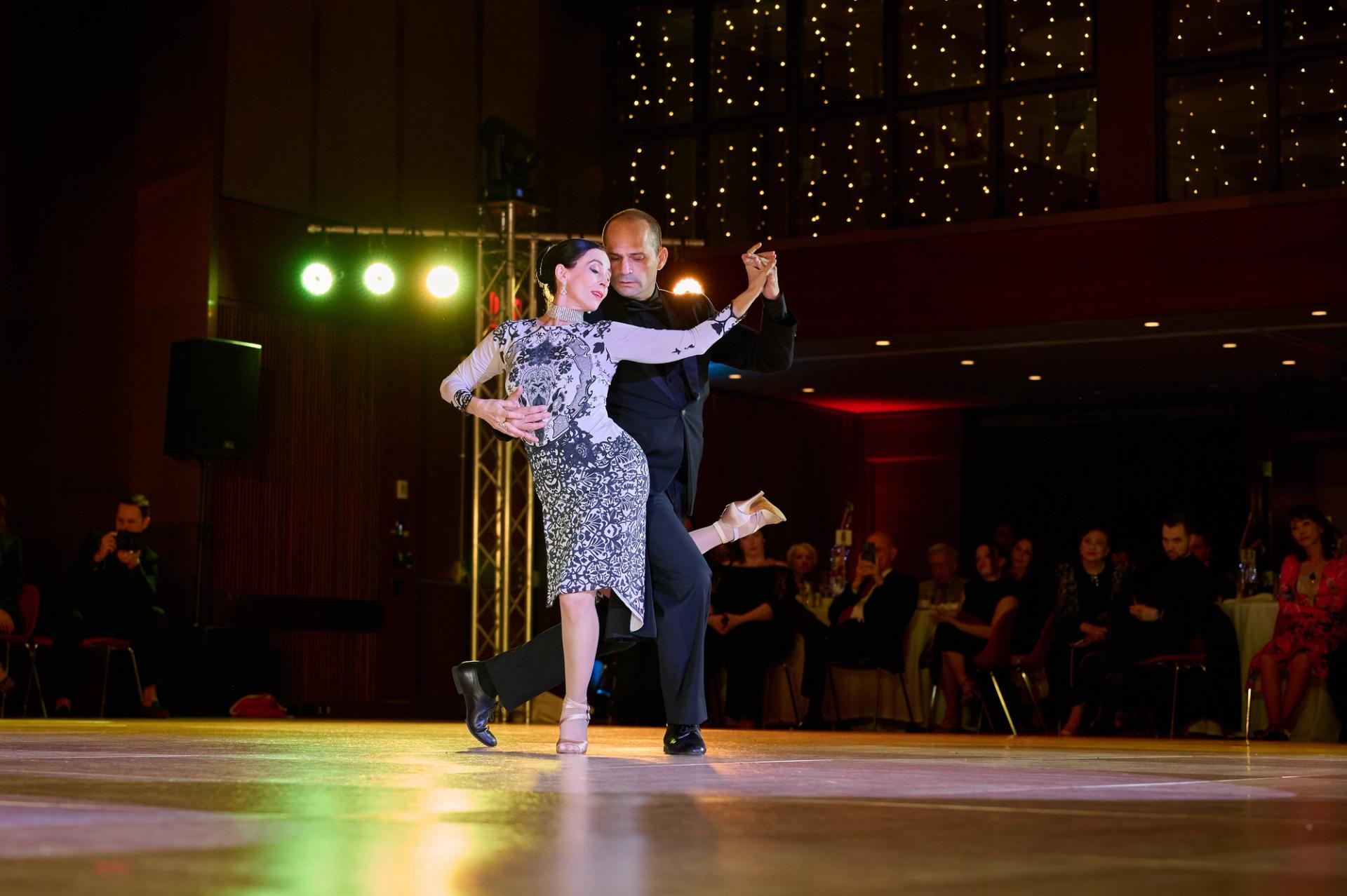 A couple mid-gancho in an Argentine tango on the gala floor at the City's Dancesport Challenge.