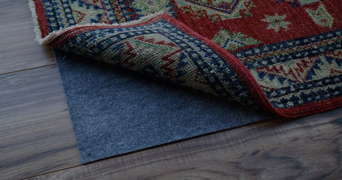 A Rug In Place On Wood Floors, How To Keep Area Rugs From Sliding On Laminate Floors