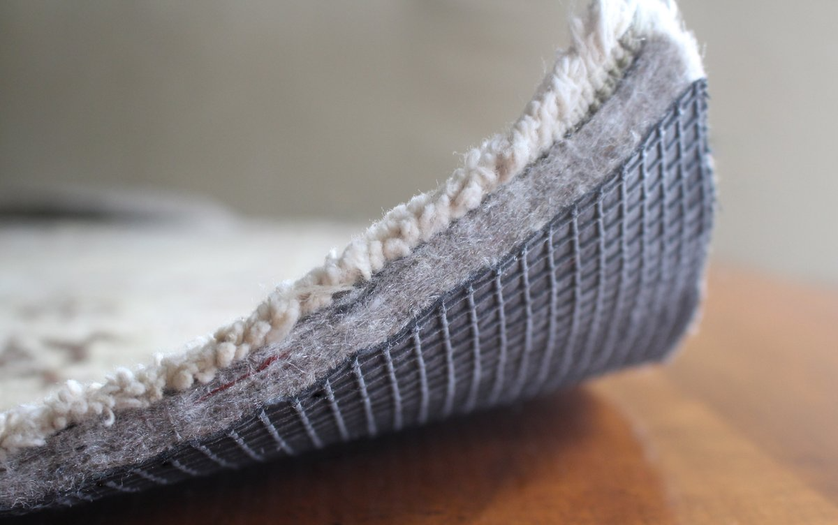 rug pad materials comparison natural rubber felt memory foam