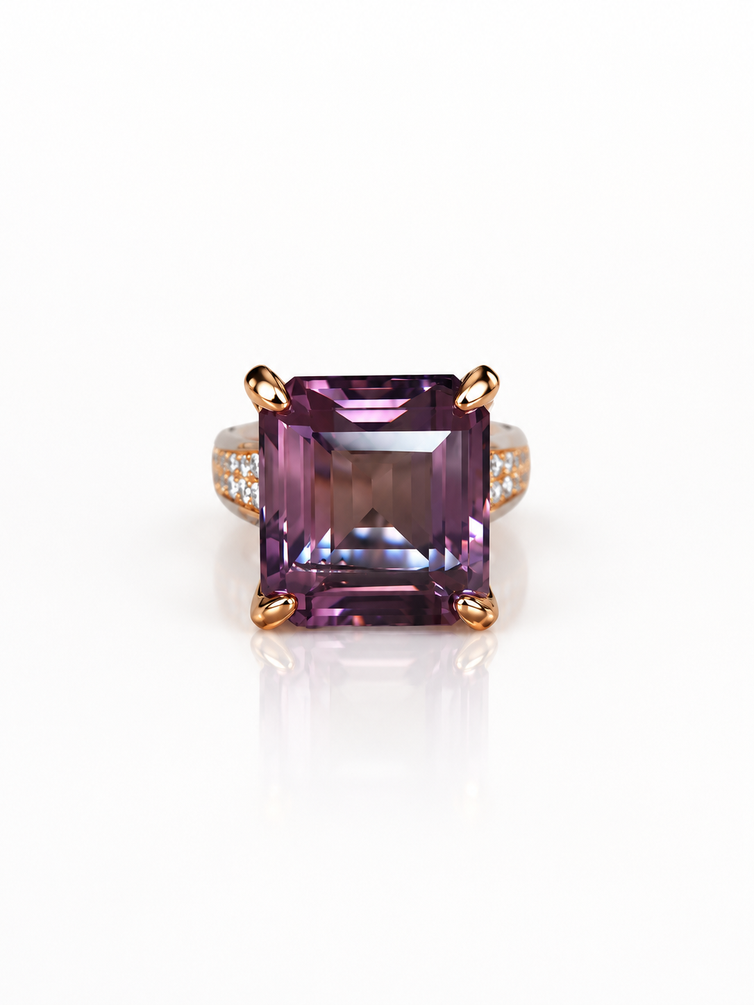 Emerald-cut lavender amethyst ring with rose gold claws and a cubic zirconia band on a white background