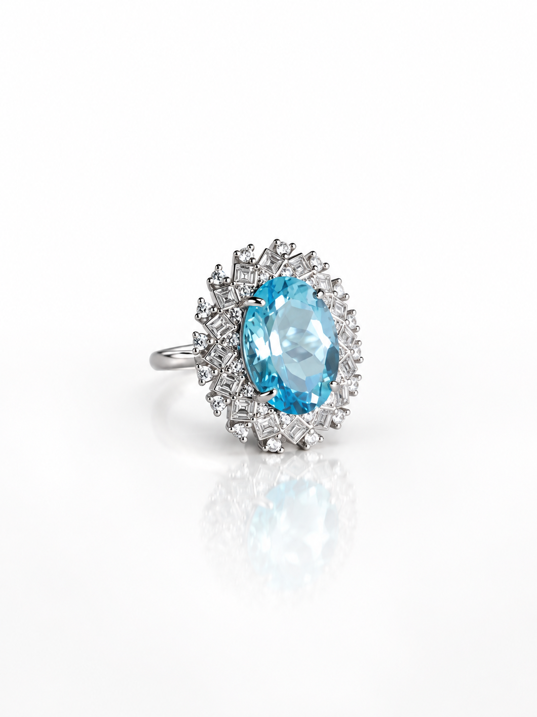 Blue topaz halo ring, angled view on a white background