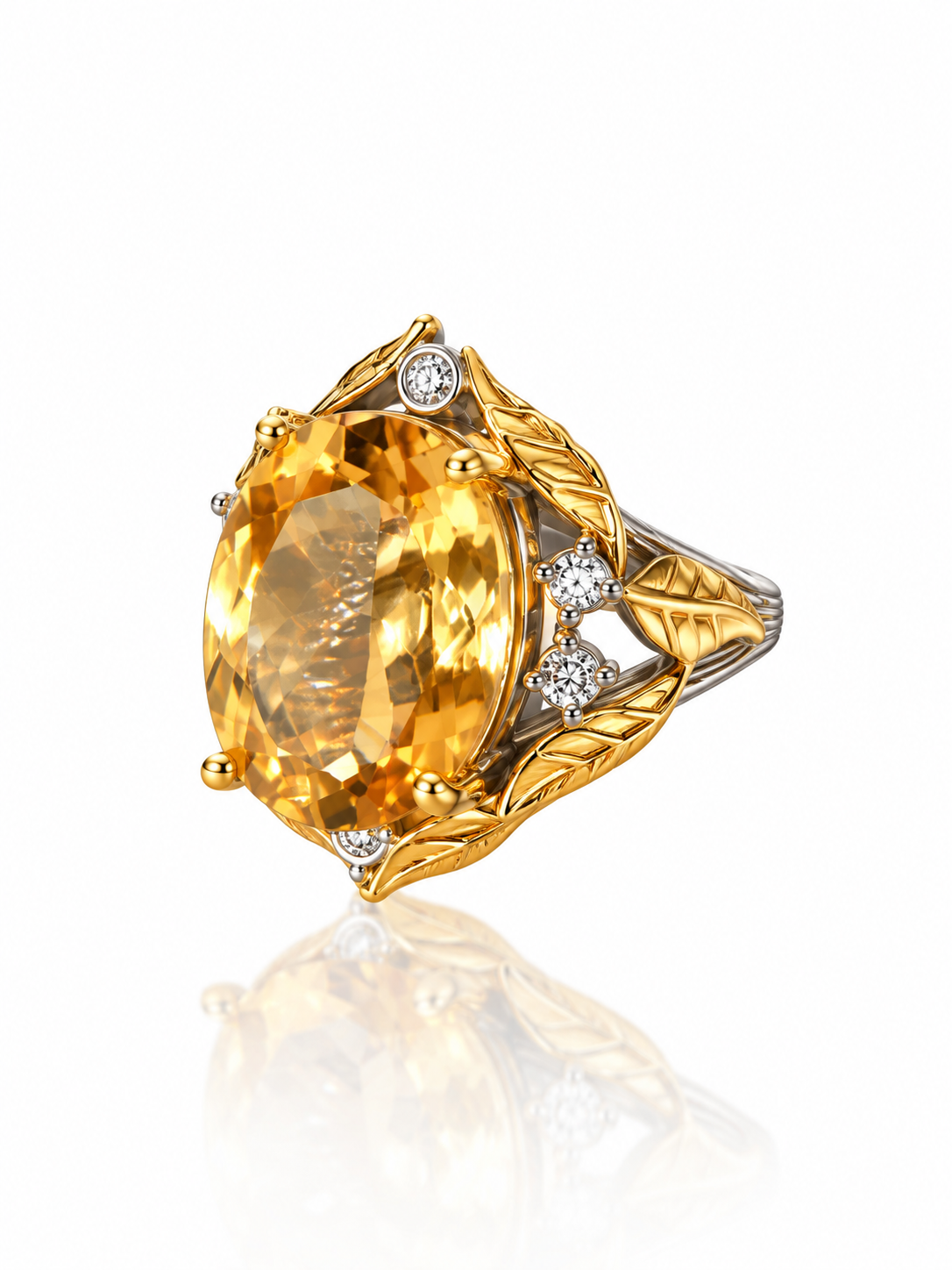 Citrine oval ring wrapped in sculpted gold leaves on a two-tone sterling silver band with cubic zirconia accents