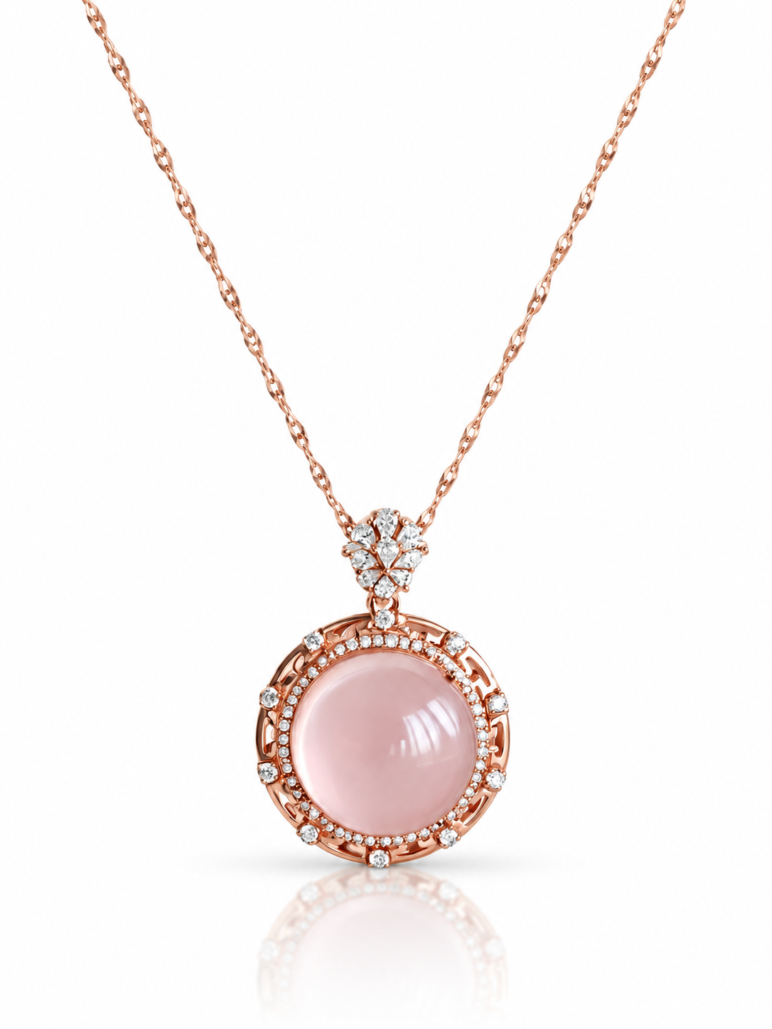 Star rose quartz round cabochon pendant necklace in rose gold with cubic zirconia border on a white background