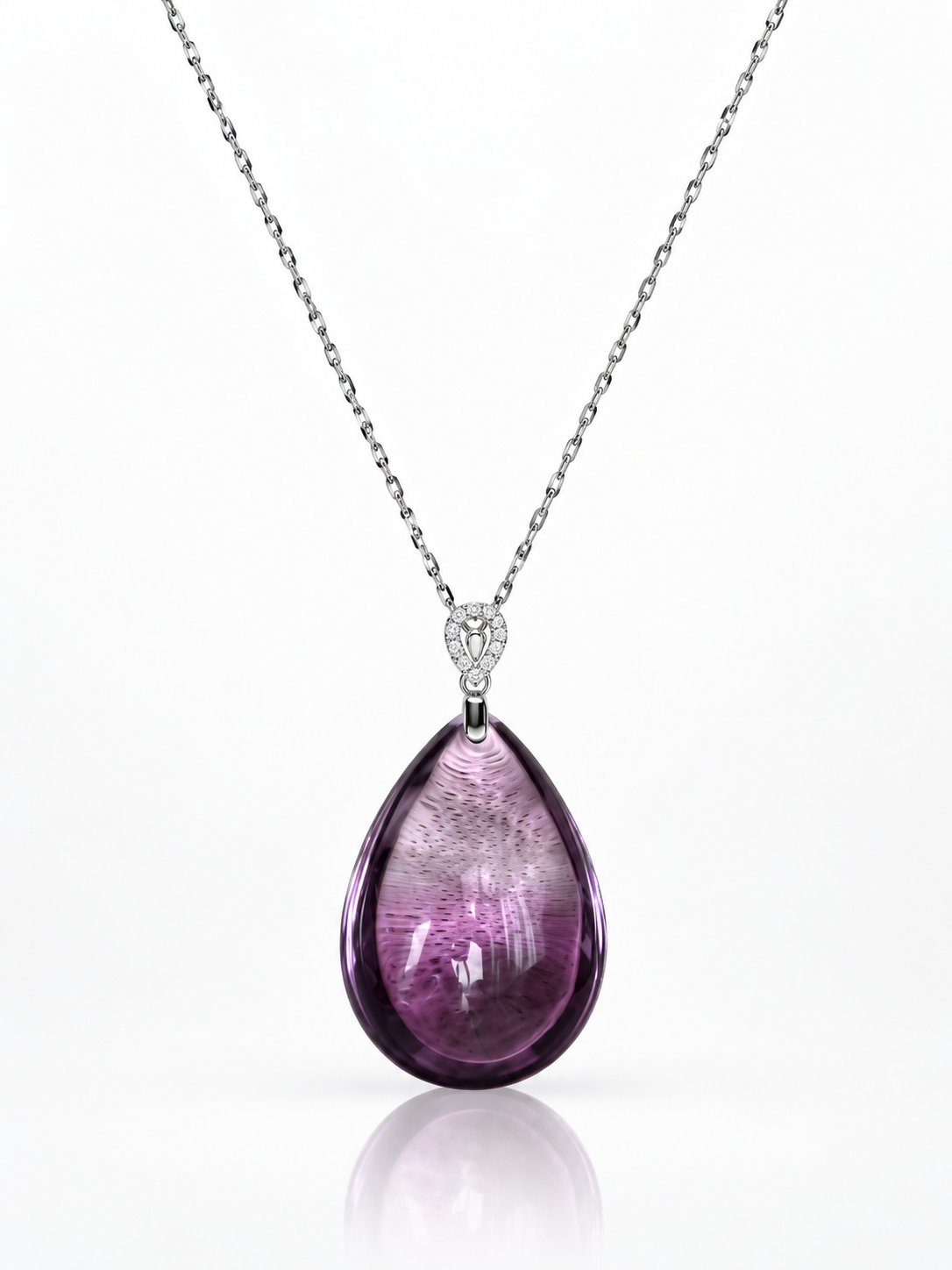 Large polished amethyst drop pendant necklace with natural violet colour bands and a pavé cubic zirconia bail on a white background