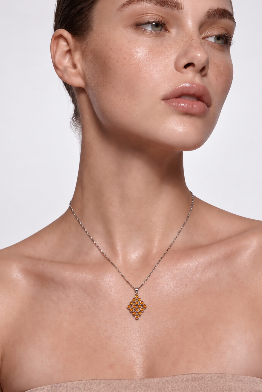 Model wearing the Golden Net citrine lattice pendant necklace, front view
