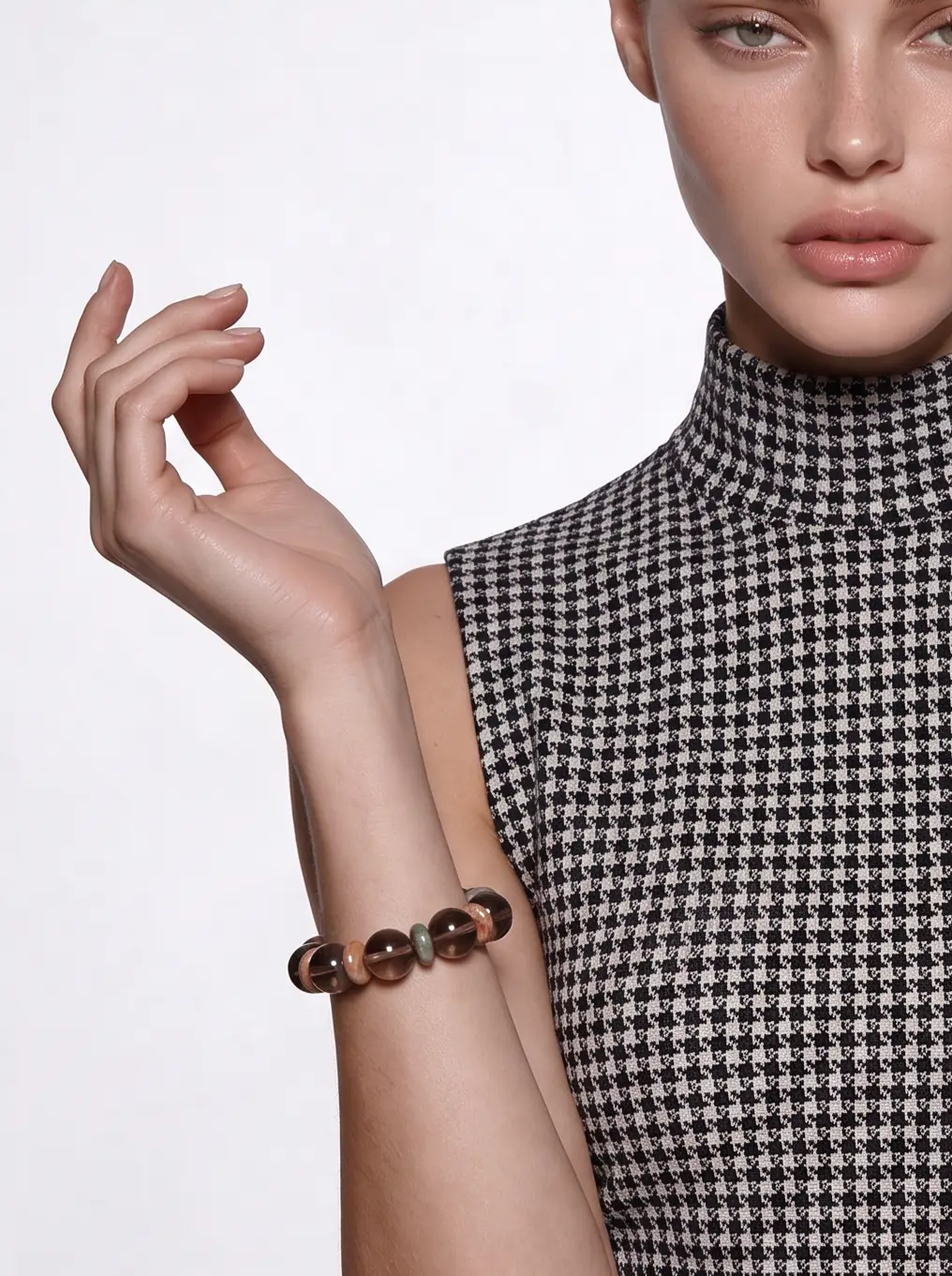 Driftwood Hour smoky quartz beaded bracelet worn on a raised wrist, showing the tea-brown beads and agate spacers