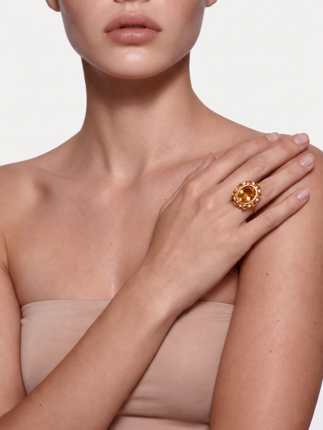 Model wearing the Golden Tide citrine cluster ring, hand resting on the shoulder