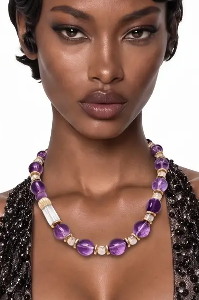 Model wearing the Imperial Tide amethyst and clear quartz necklace with a black embellished gown, full-length view