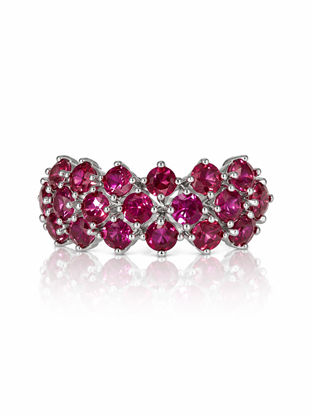 Garnet band ring with three rows of round wine-red garnets in sterling silver on a white background