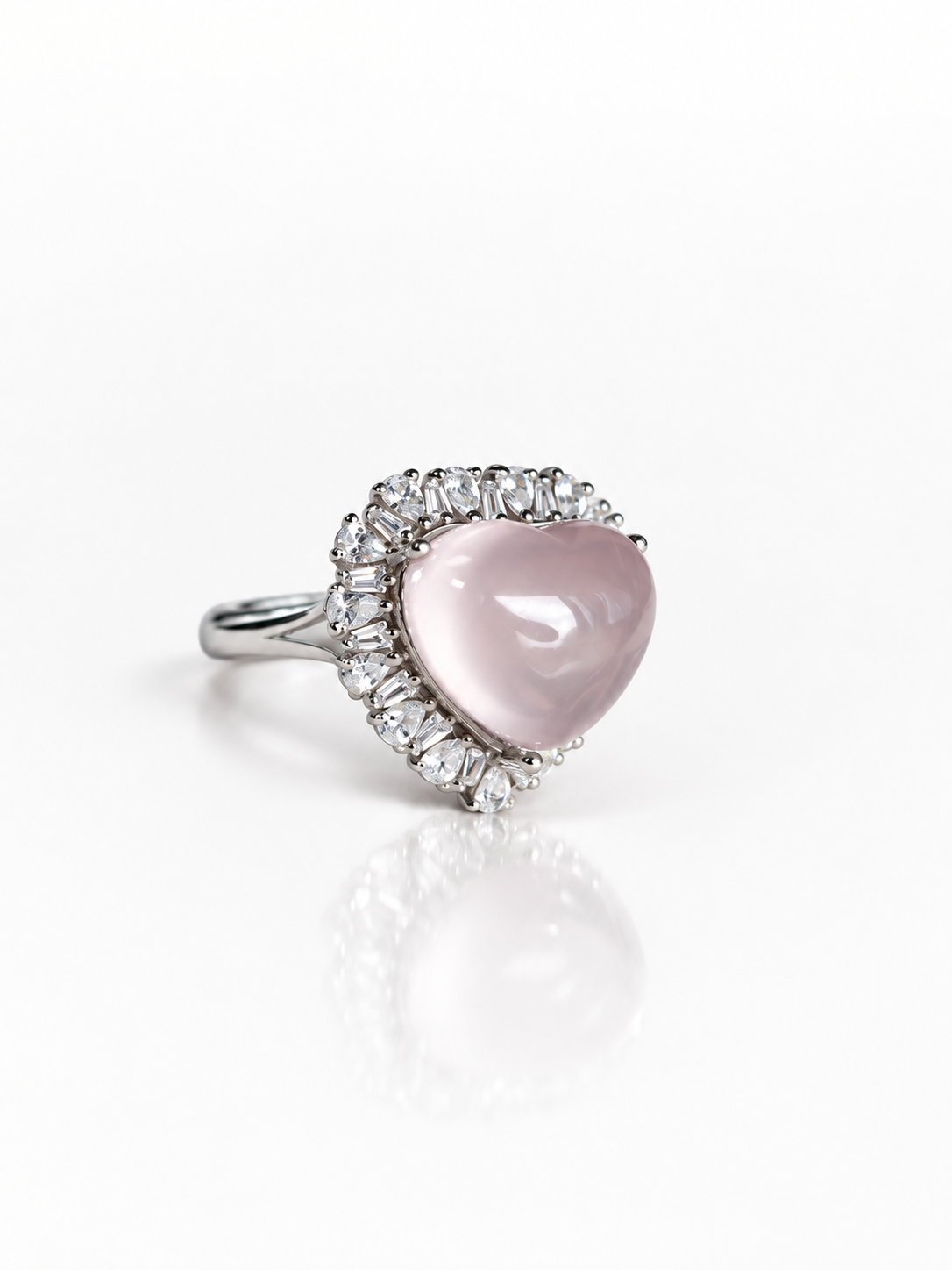 Rose quartz heart halo ring, angled view on a white background