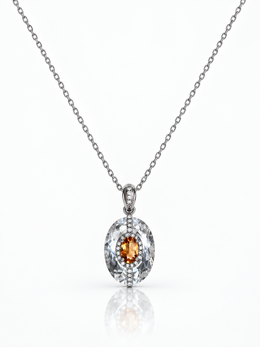 Clear quartz oval pendant with a citrine centre stone and a line of cubic zirconia in sterling silver on a white background