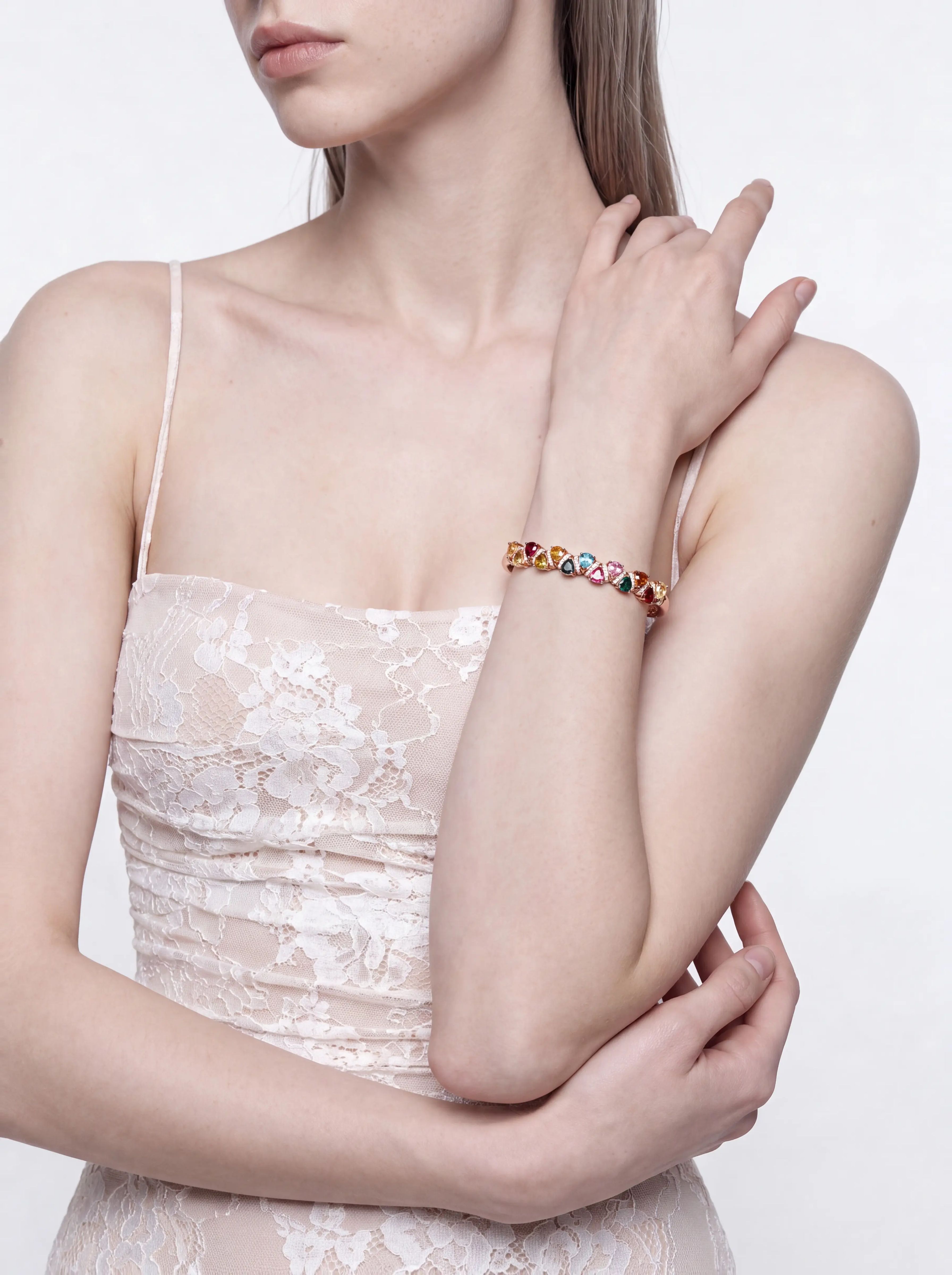 Close-up of the multicolour tourmaline bangle with thirteen pear-cut stones worn on the wrist