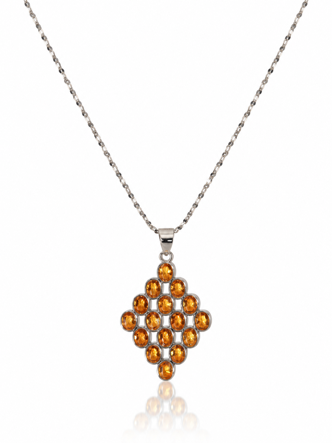 Citrine lattice pendant necklace with round golden citrines set in a diamond shape on a sterling silver chain, white background