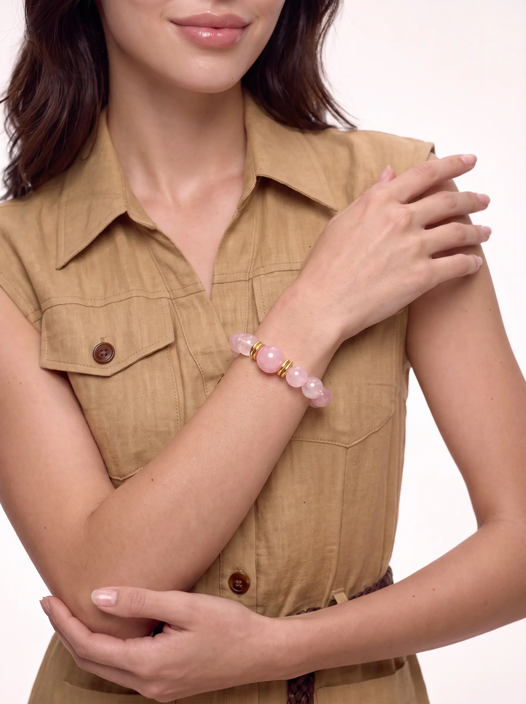 Model wearing the Seashell Dawn rose quartz and pink snowflake phantom bracelet on the wrist