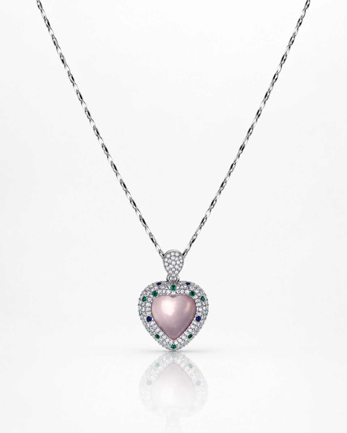 Rose quartz heart pendant necklace with pavé cubic zirconia halo and green and blue tourmaline accents in sterling silver on a white background