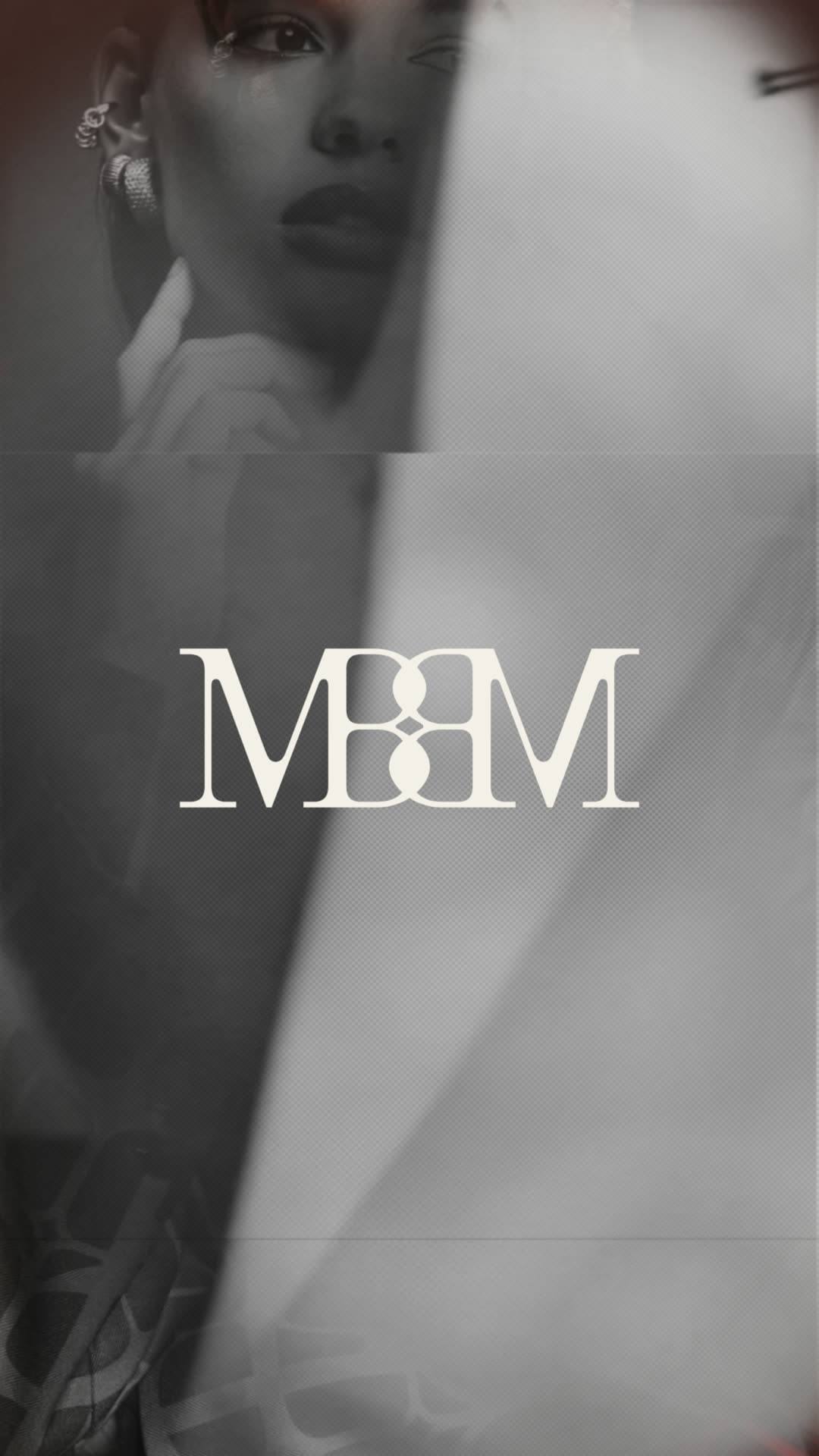 The Made by Madelen monogram held in cream over a black-and-white portrait, a sheet of fabric sweeping across the frame.