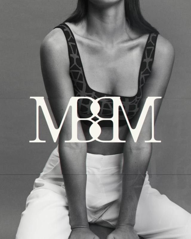 The Made by Madelen monogram in cream over a black-and-white portrait, the model in a monogram-print bra and white trousers.