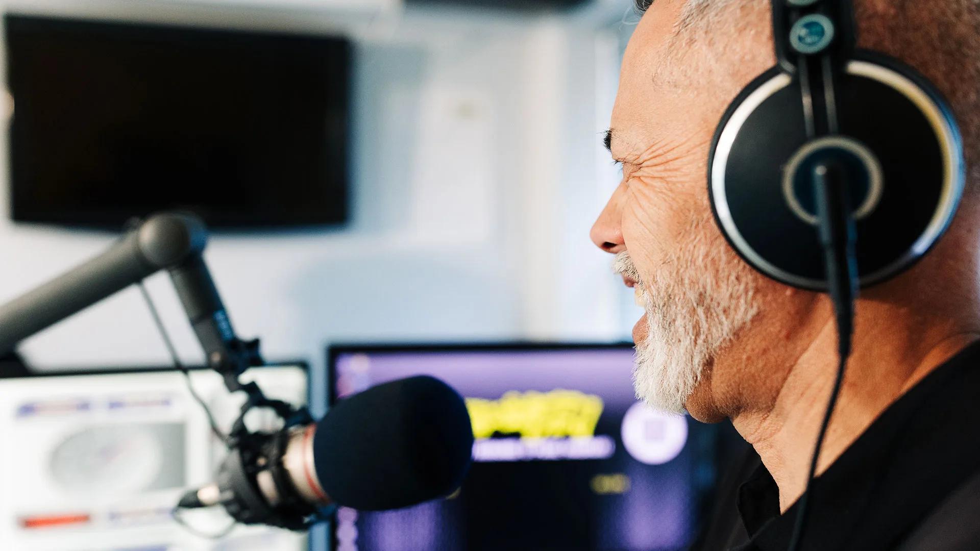 Rino behing the microphone at Ngāiwi FM