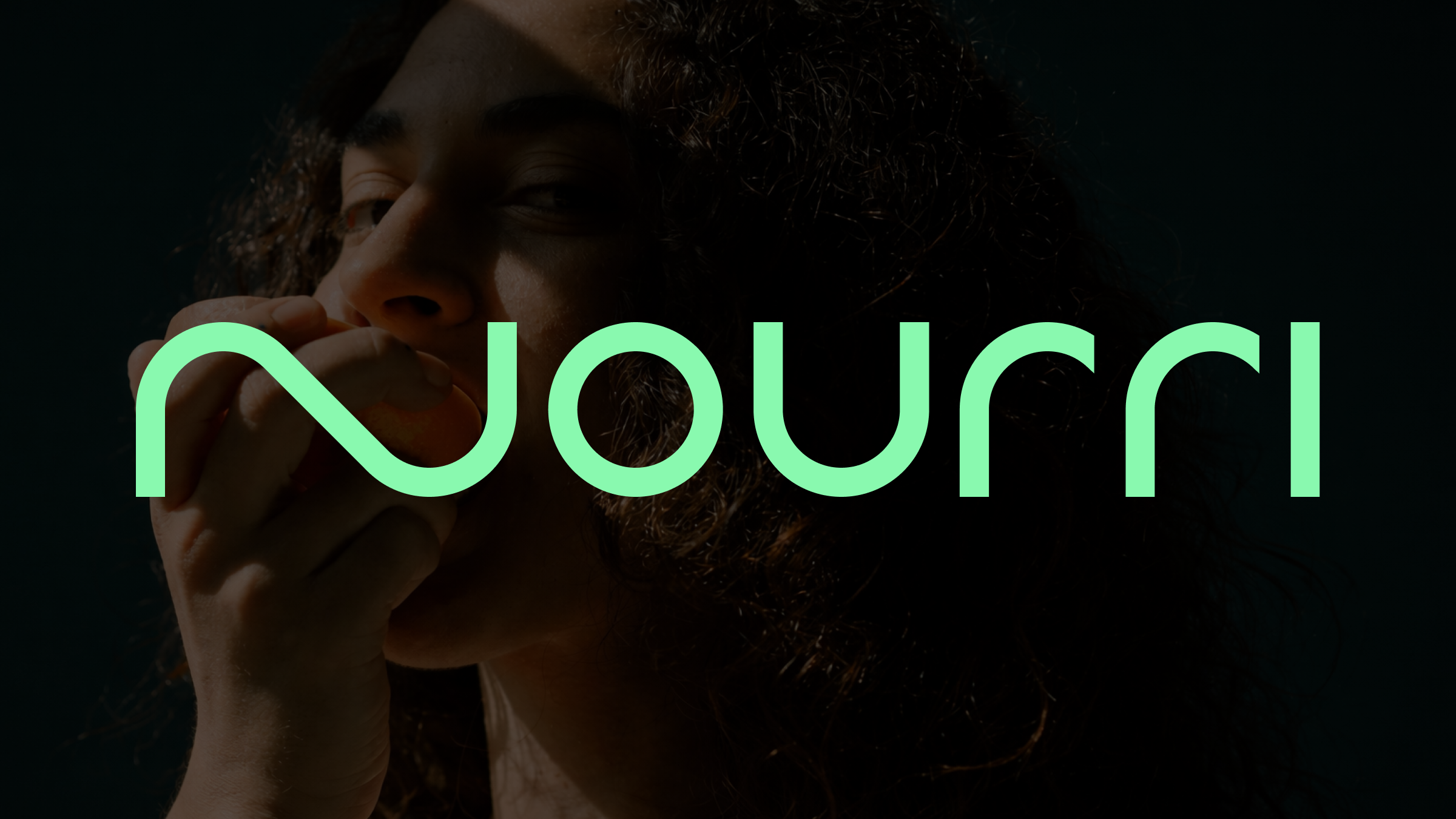 Nourri wordmark in mint green over a dark, close-cropped photo of a woman eating