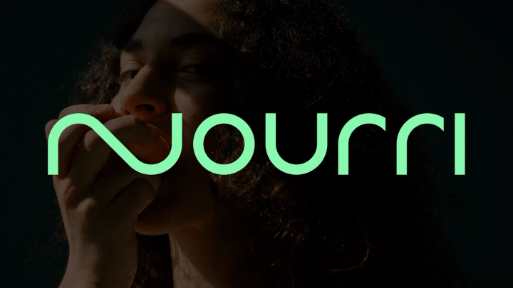 Nourri wordmark in mint green over a dark, close-cropped photo of a woman eating