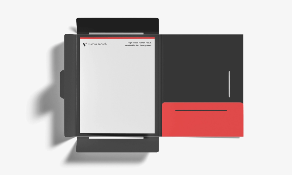 Vistara Search letterhead with the logo and the tagline 'High Touch. Human Focus.' in an open black presentation folder with a red pocket