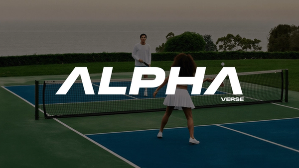 Alphaverse logo in white over a photo of two people playing pickleball on a blue and green court by the ocean