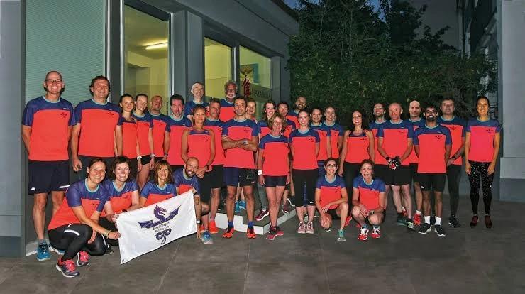 Basel Dragons members in club shirts outside the clubhouse