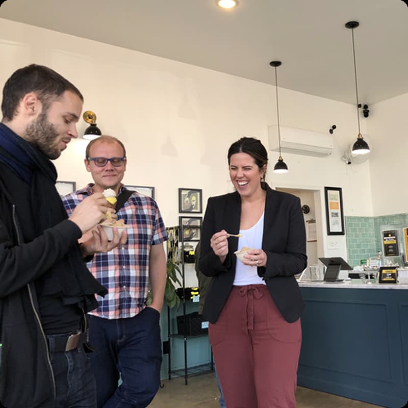Kelly, Eric, and Will laughing and eating ice cream