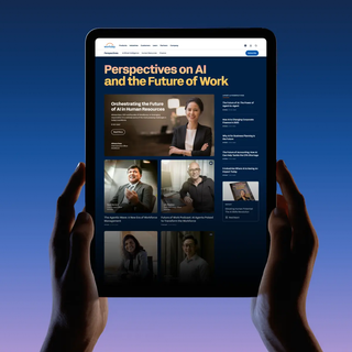 A pair of hands holds up an iPad with the Workday Perspectives site open