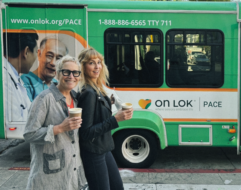 Suzanne and Kim in front of the OnLok bus Boldium designed.