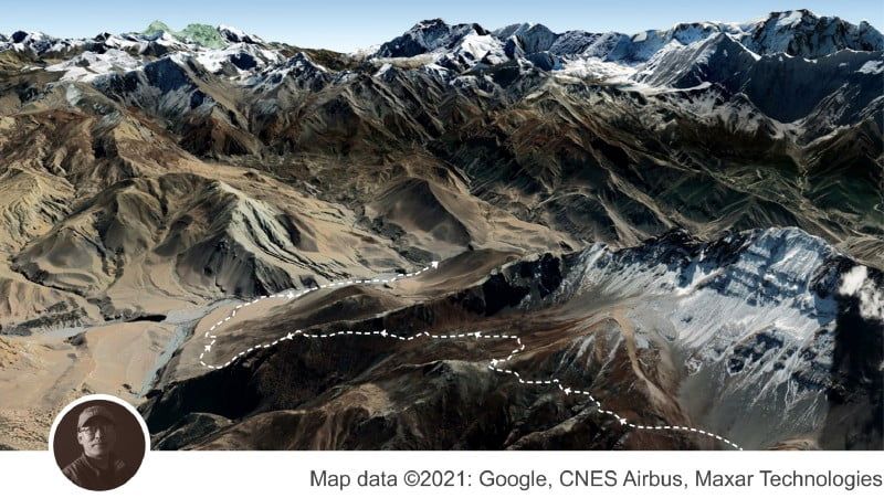 3D satellite view of a winding mountain trail marked with a dotted line across steep ridges and snowy peaks, along with an inlaid image of Nirmal Sherchan.