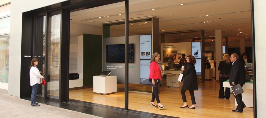 Shoppers walking on bamboo floors installed at a Sony store