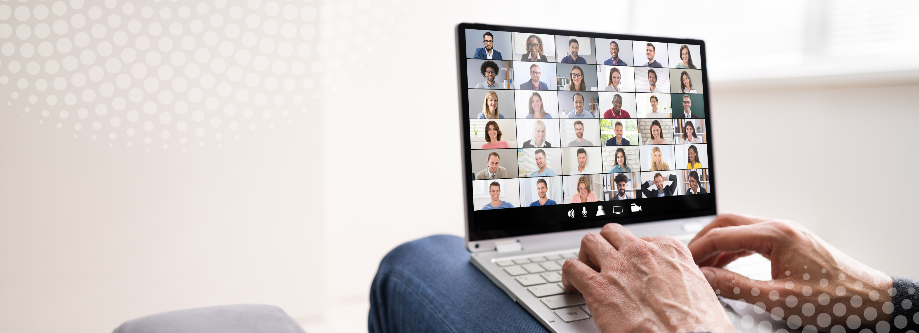 A laptop screen showing a group of people in a meeting 