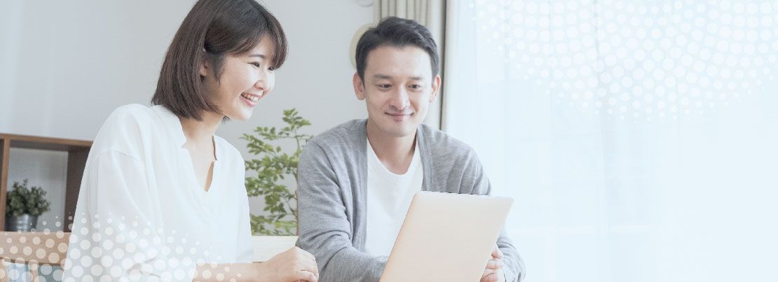 A couple looking at their laptop 