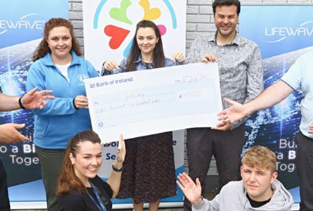 Lifewave team holding a big check 