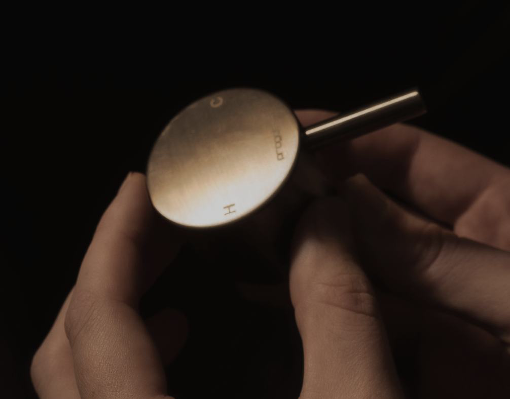 A Buddy mixer handle held in the hand