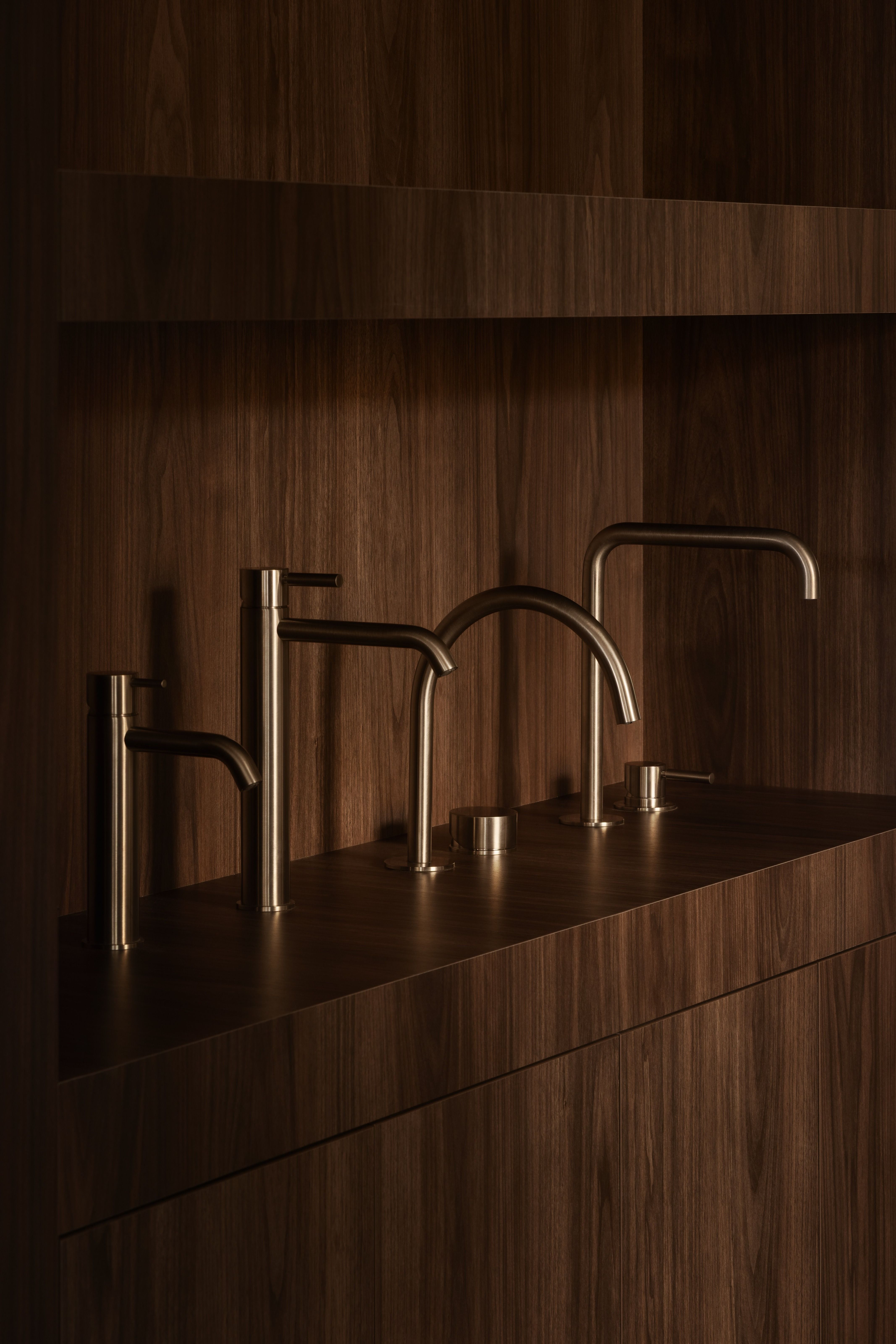 Range of tapware finishes on timber vanity