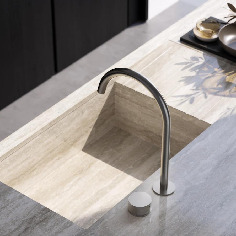 Undermount stone basin with a brushed gooseneck mixer