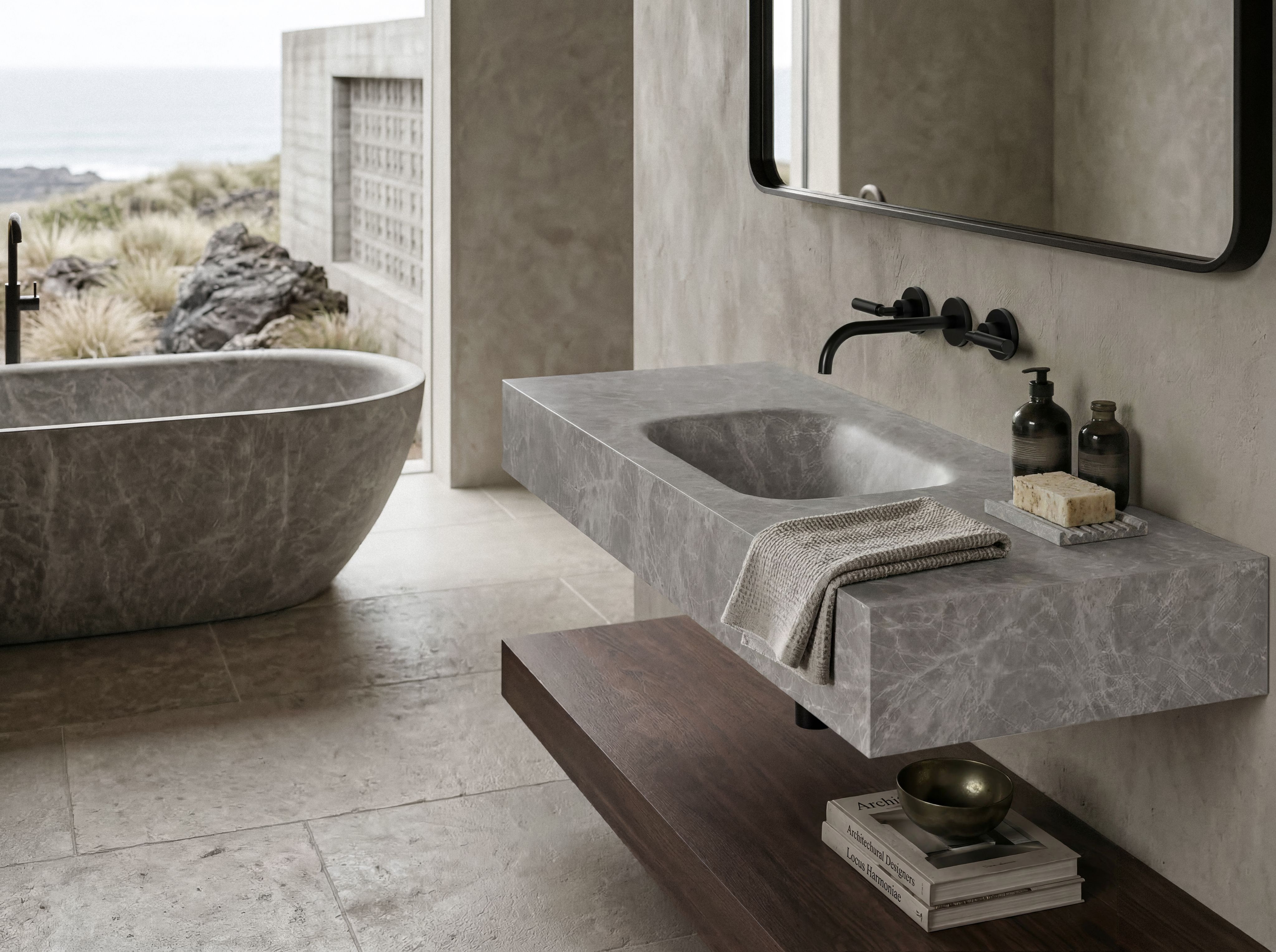 Marmo marble basin on a stone vanity beside a stone bath