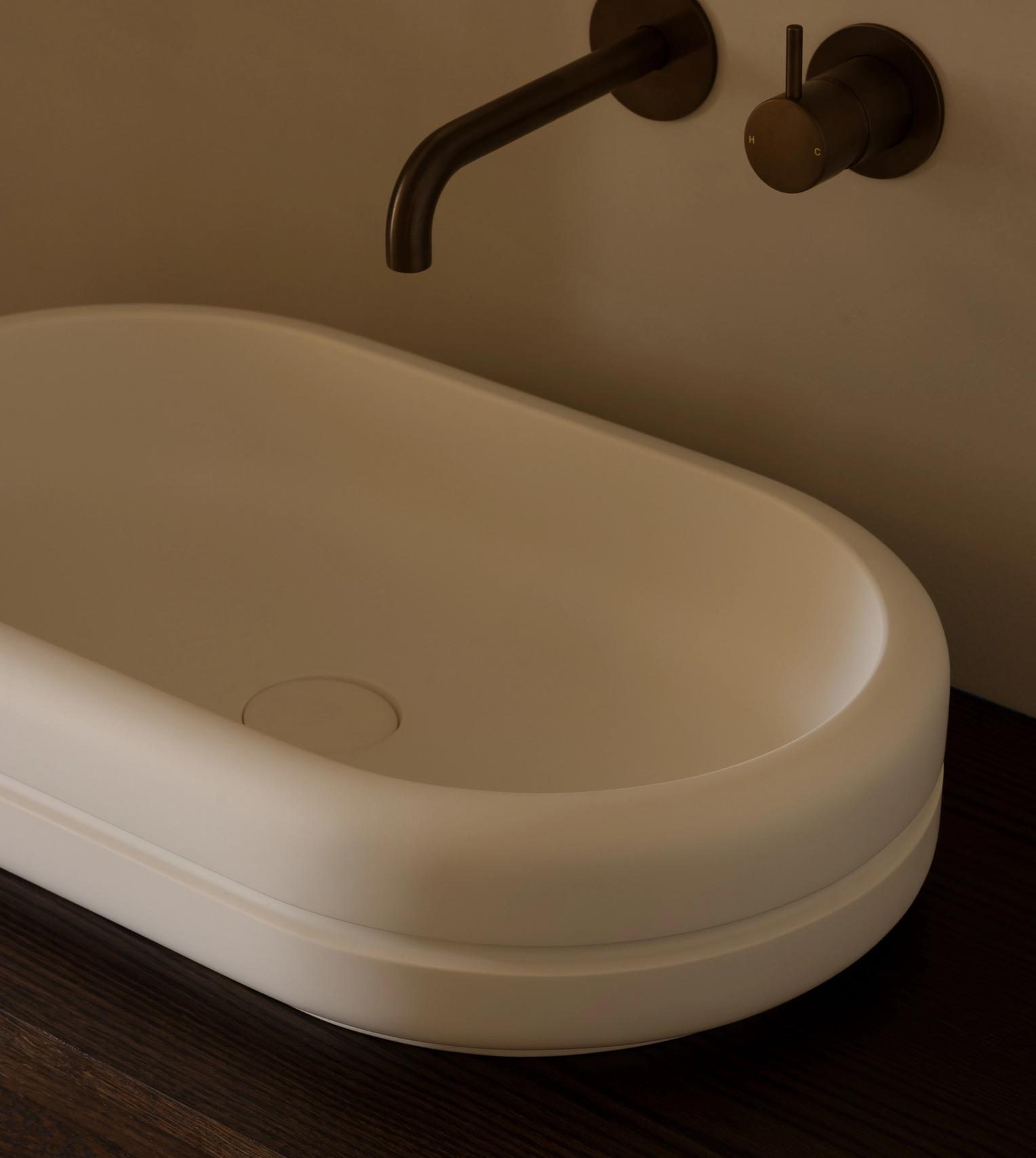 Wall mounted bronze tapware and basin