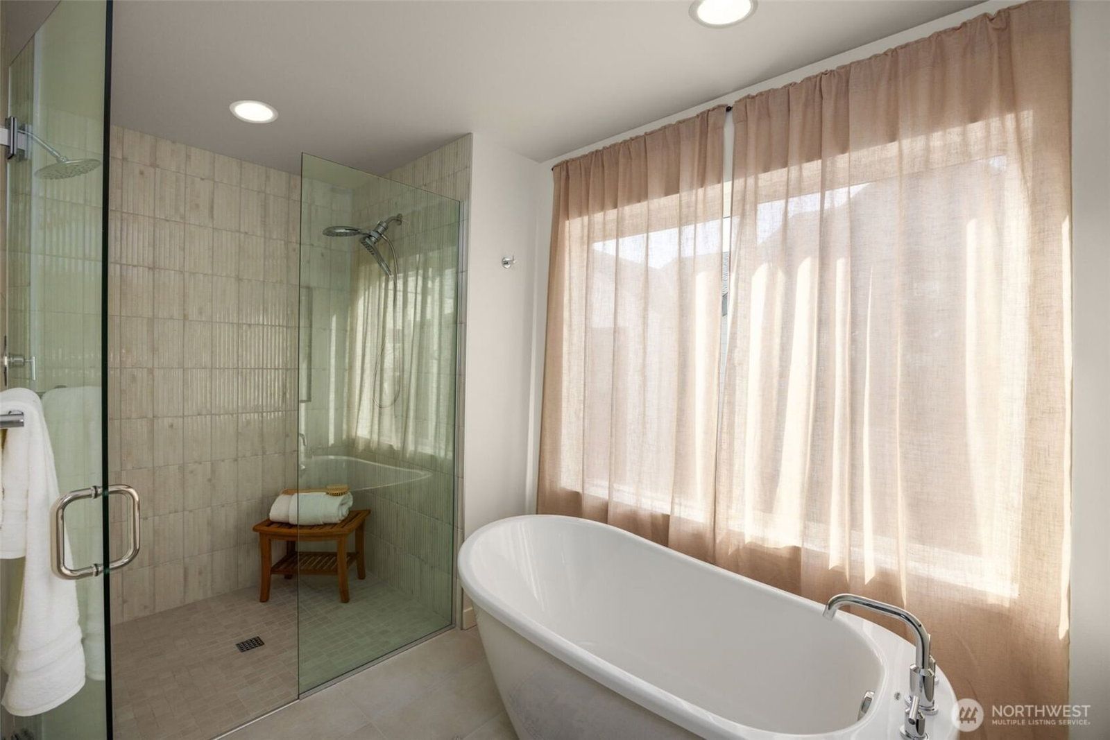 Primary bath with a walk-in shower and soaking tub