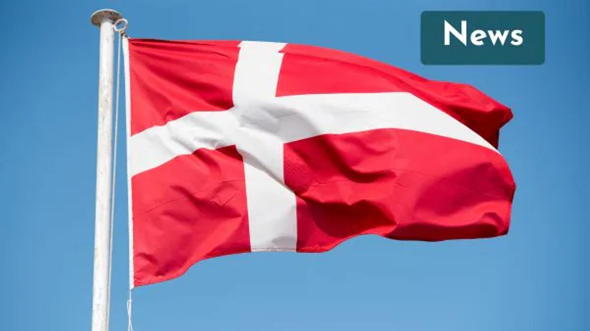 The Danish flag flying against a blue sky