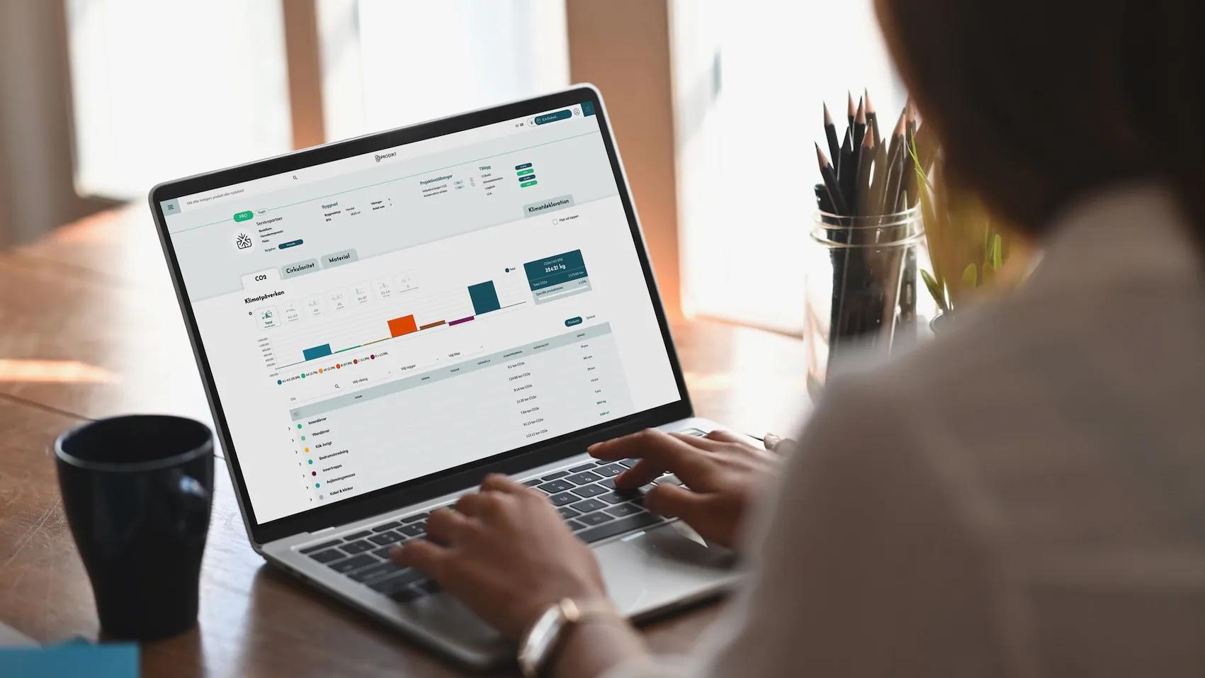 Person typing on a laptop that shows a Prodikt project dashboard