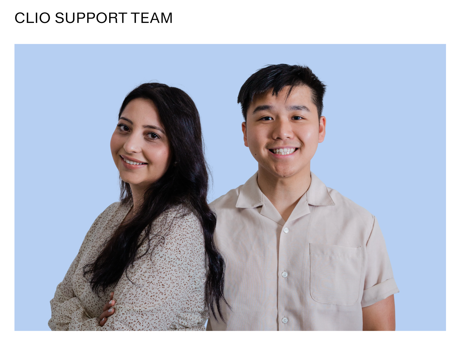 Two smiling members of the Clio support team, a woman and a man.