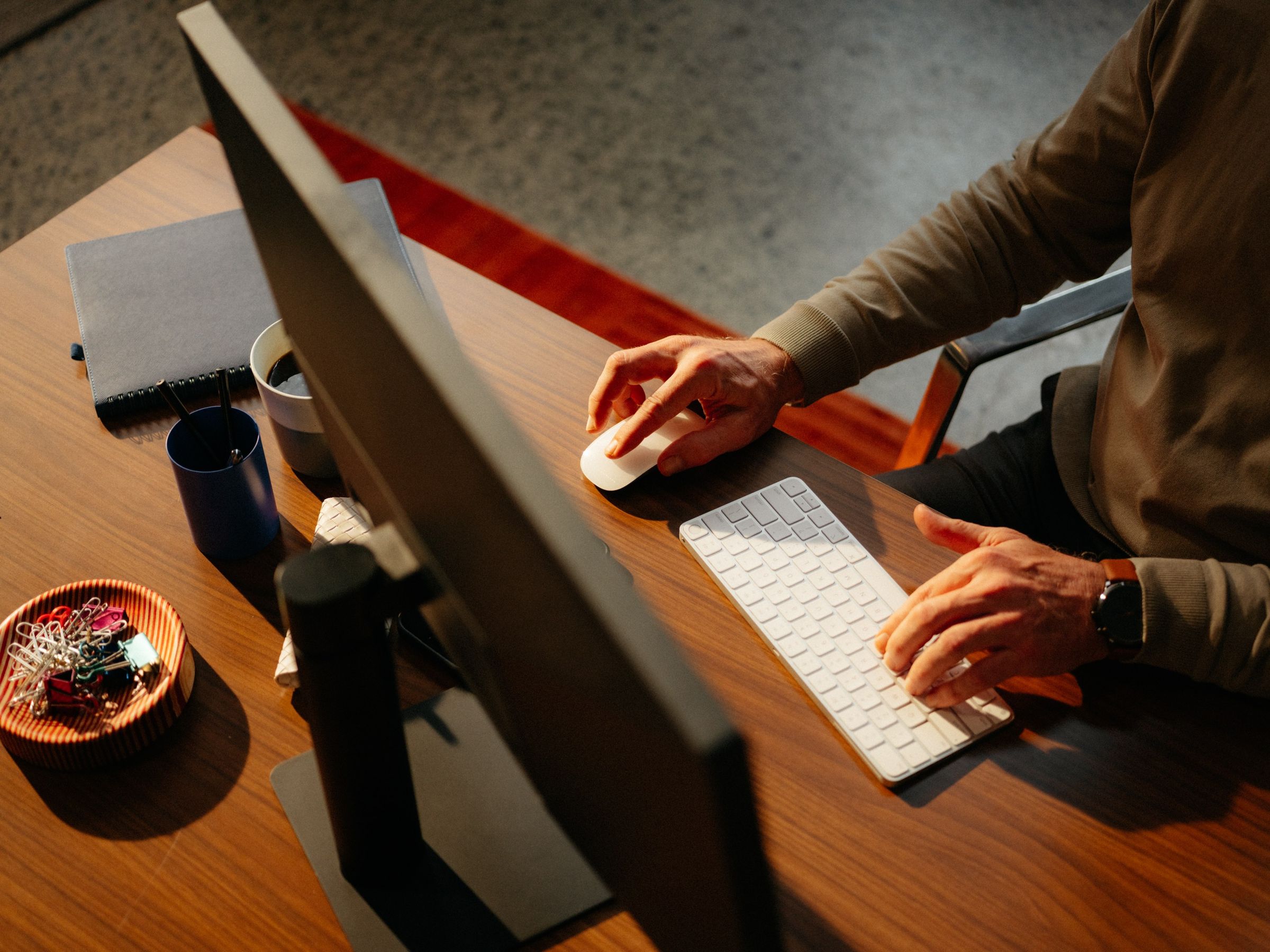 A lawyer working at a desktop computer