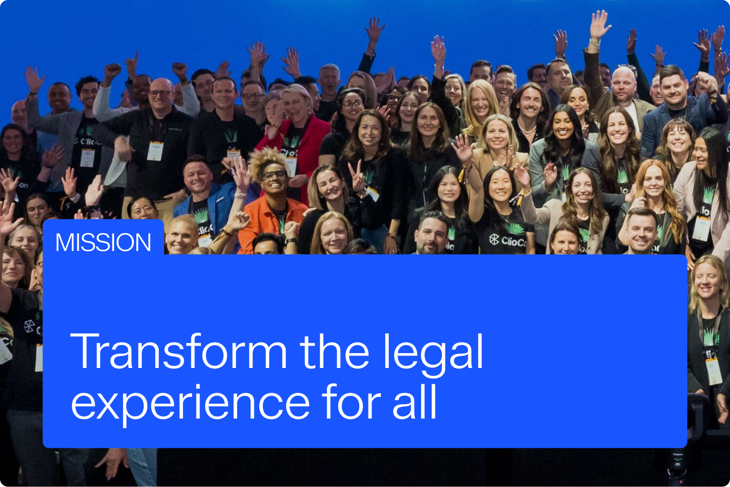 A large group of diverse people smile and wave, with a blue overlay stating "MISSION: Transform the legal experience for all."